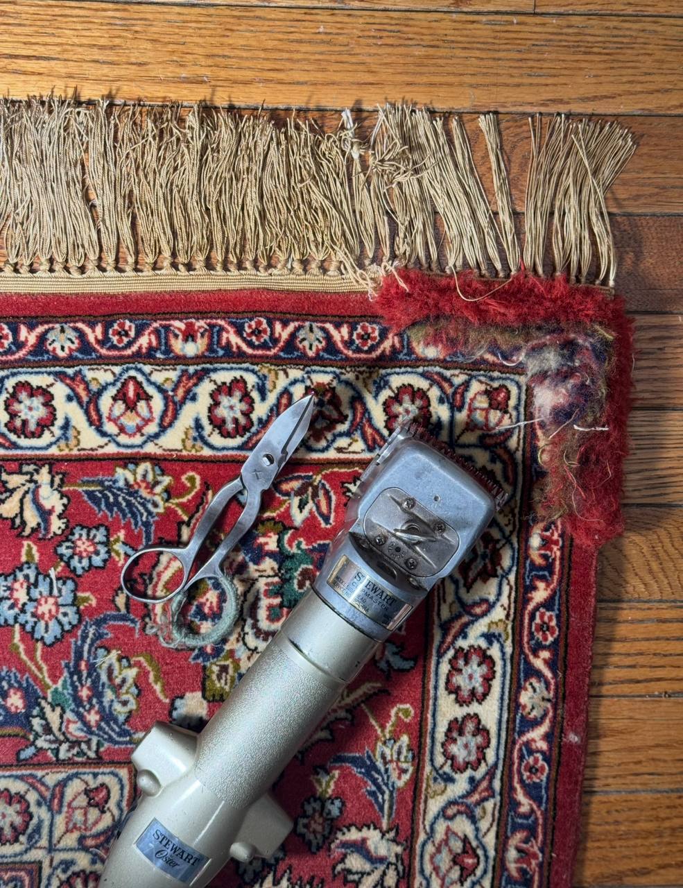 Repair and restoration of a torn corner on this antique Isfahan